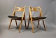 A pair of "Sawbench" dining room chairs in polished beech and suede, model CH29. 5000m2 showroom.