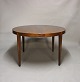 Round dining table with extensions in rosewood by Haslev Furniture from the 1960s.5000m2 showroom.