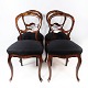 Set of four rococo dining room chairs of dark wood and upholstered with black fabric from around 1880.5000m2 showroom.